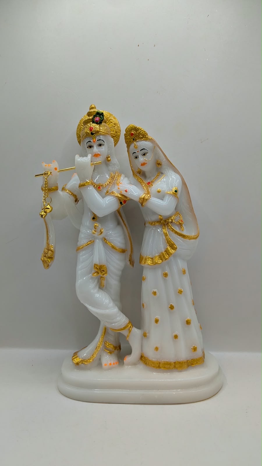 Tall white and gold Radha Krishna statue, front view