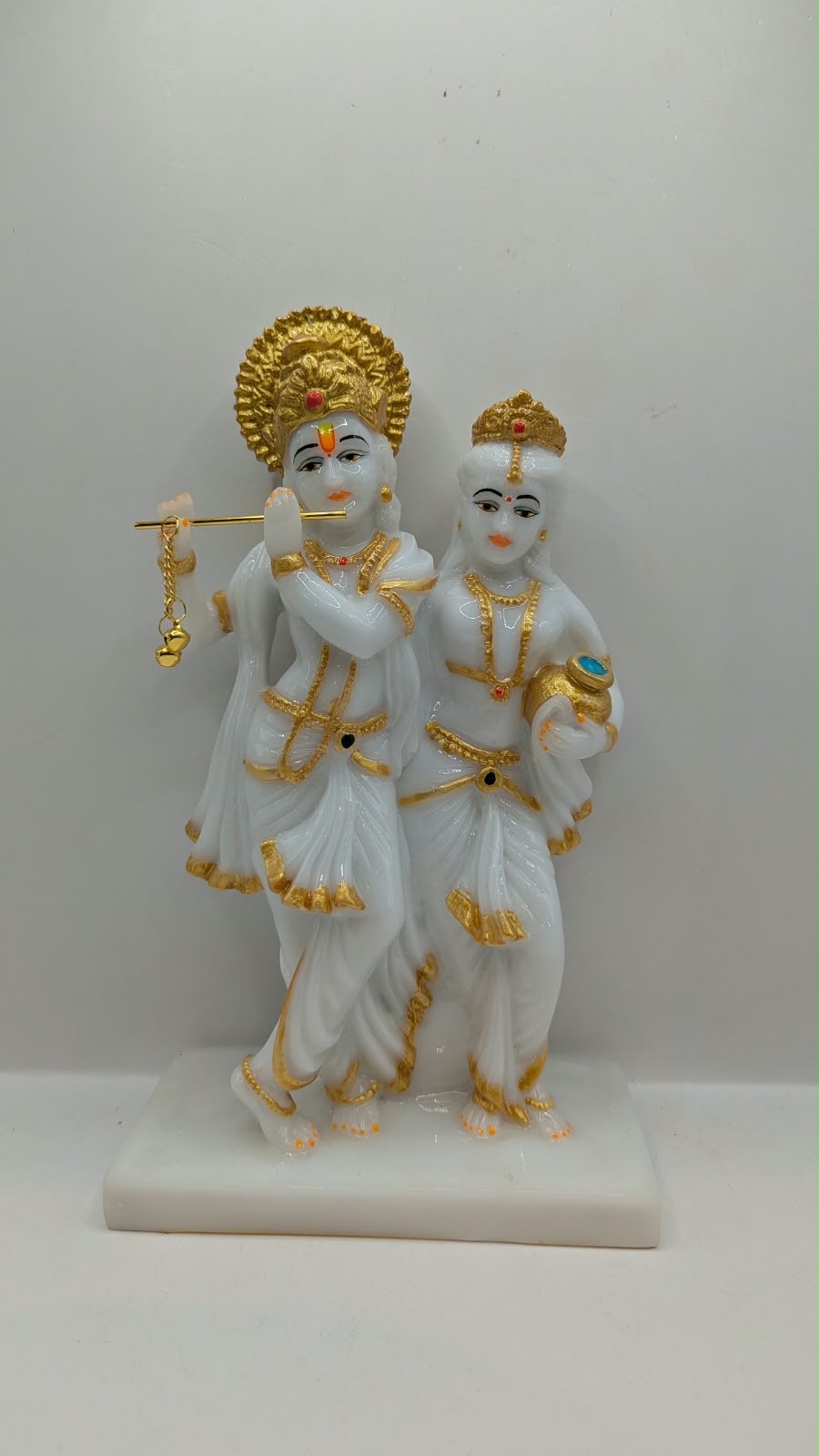White and gold Radha Krishna statue with halo, front view