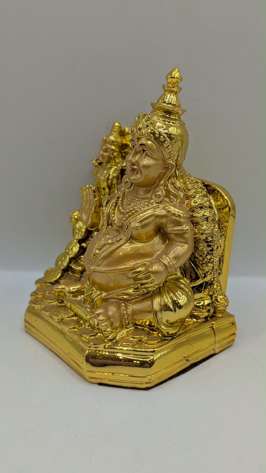 Gold Kuber statue, other side view
