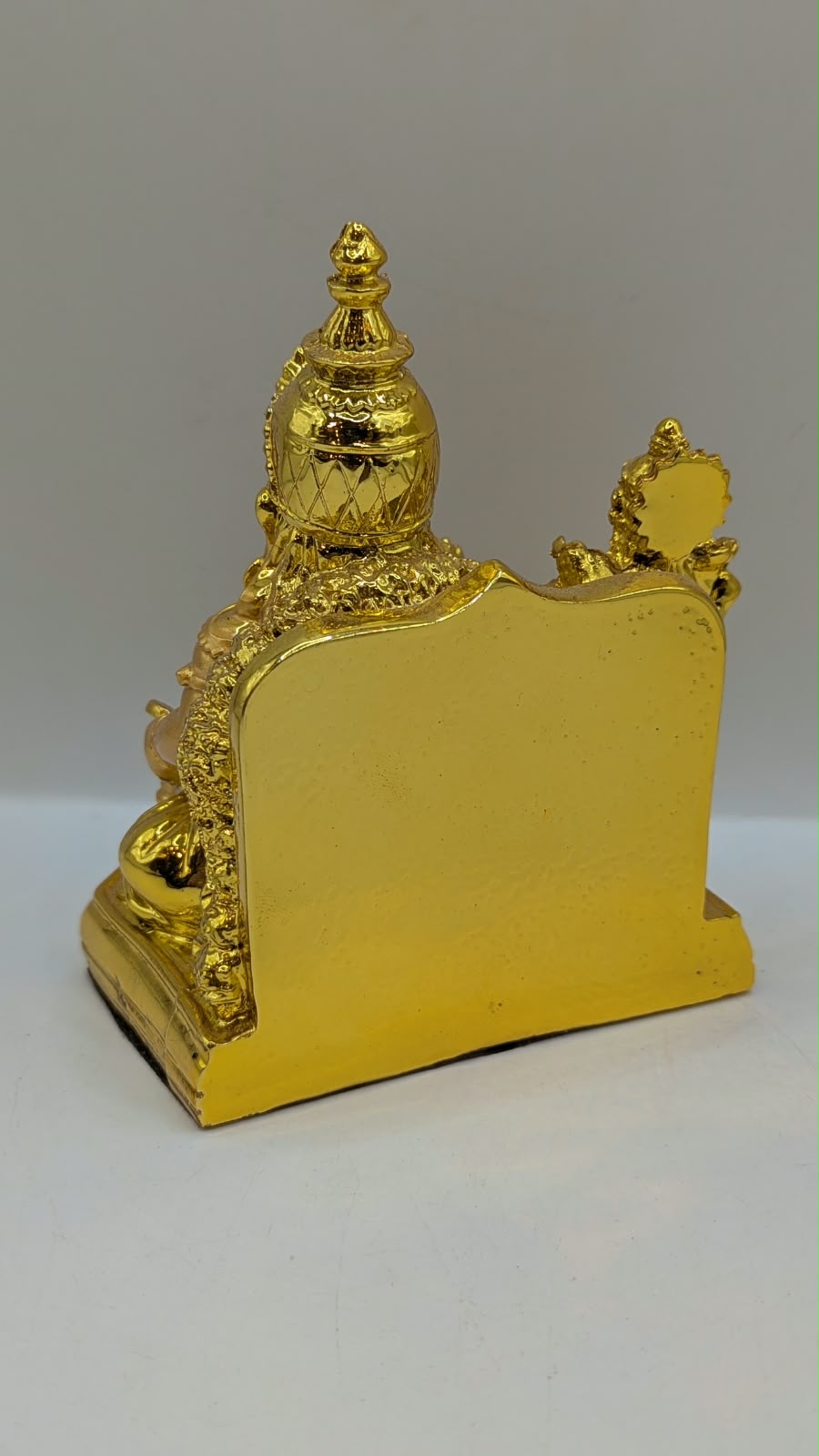 Gold Kuber statue, back view