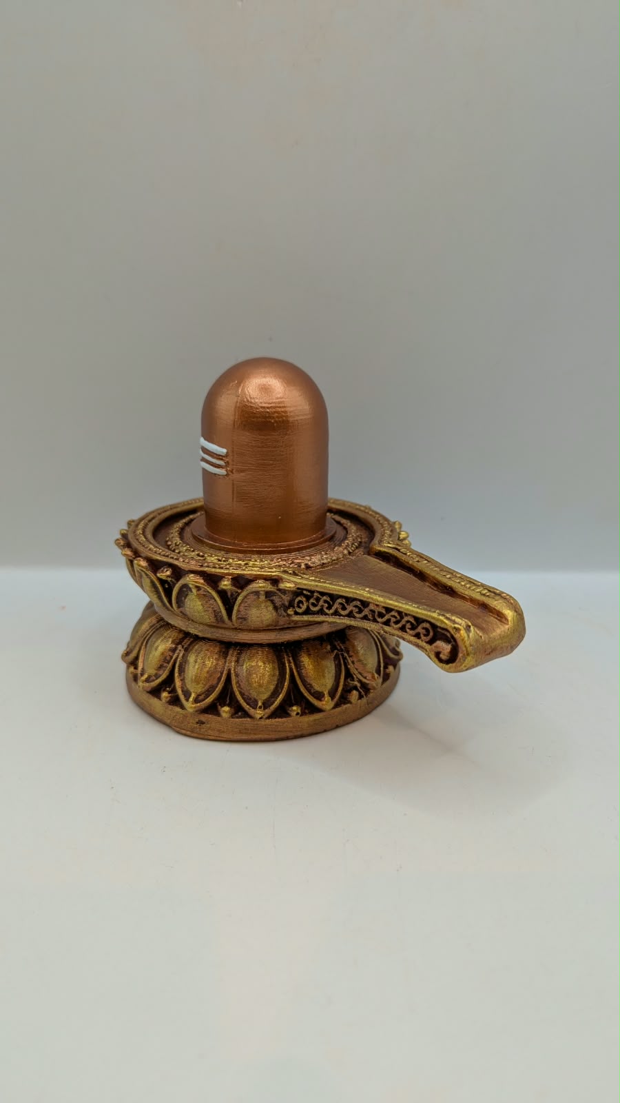 Small copper and gold Shivling statue, other side view