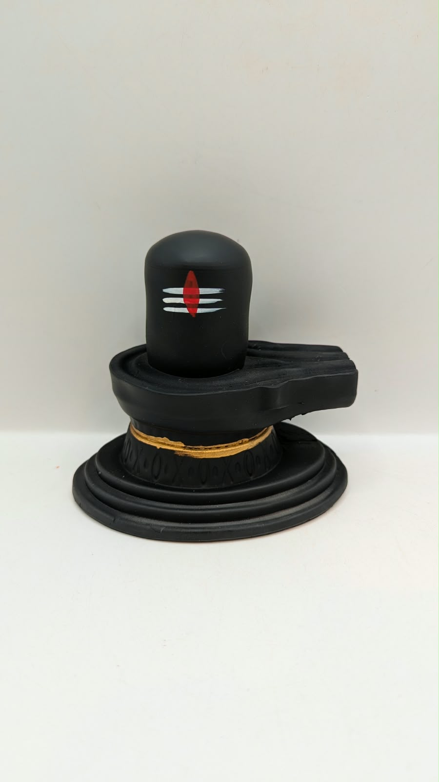 Matt black Shivling statue, front view