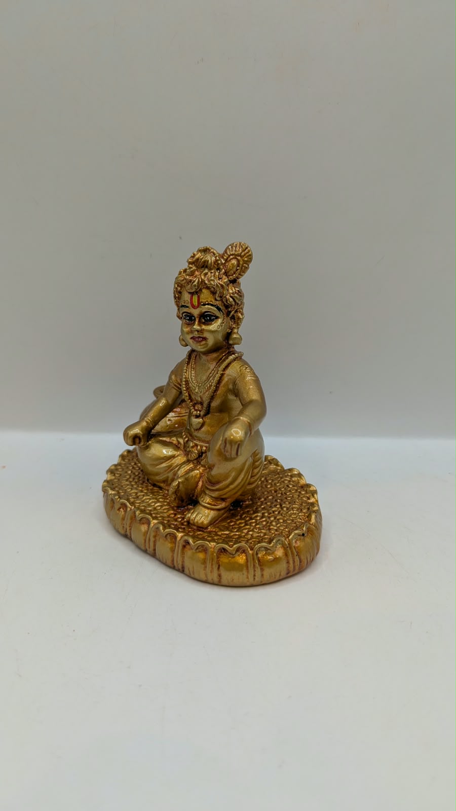 Gold Laddu Gopal baby Krishna statue, other side view