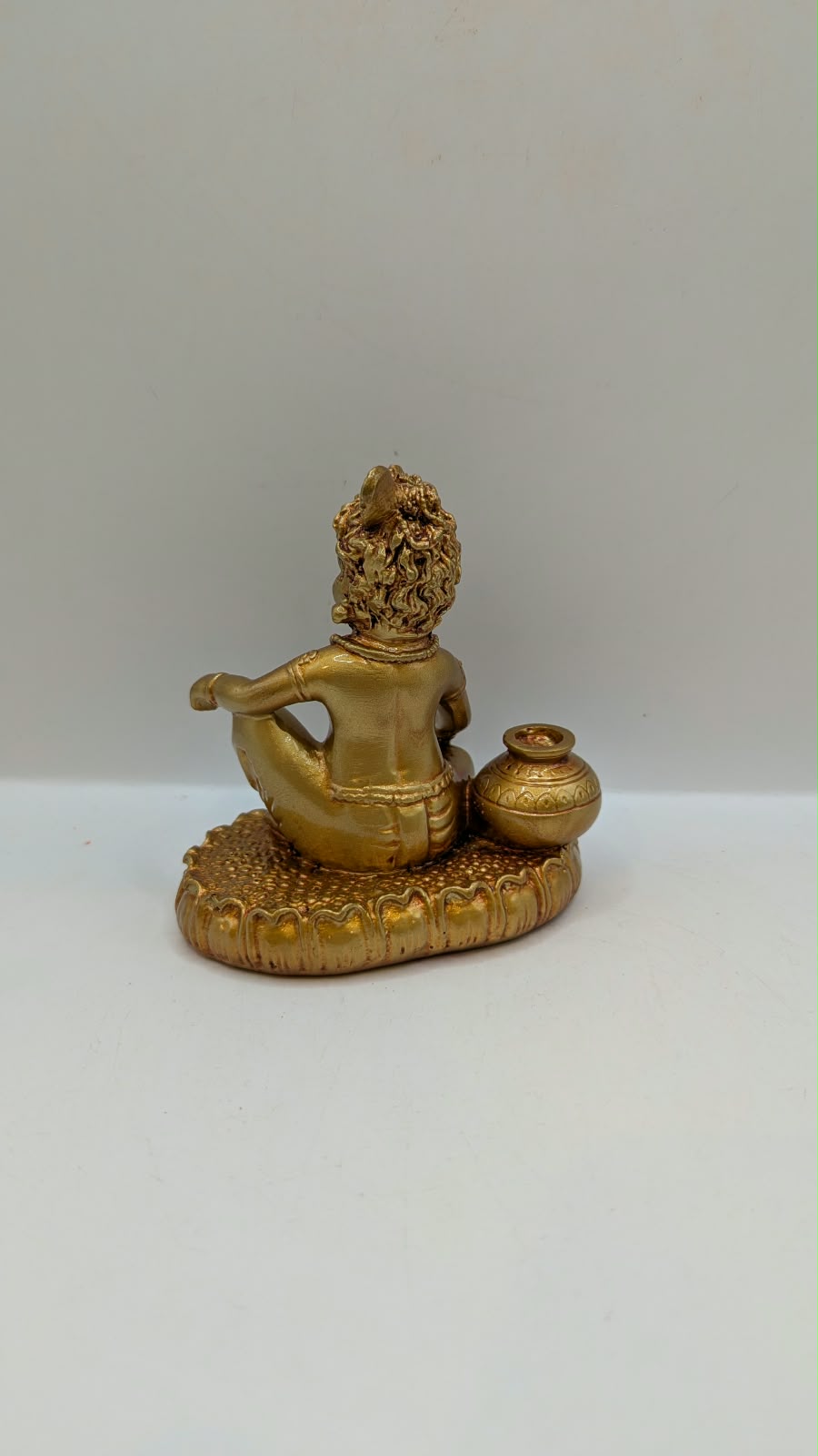 Gold Laddu Gopal baby Krishna statue, back view