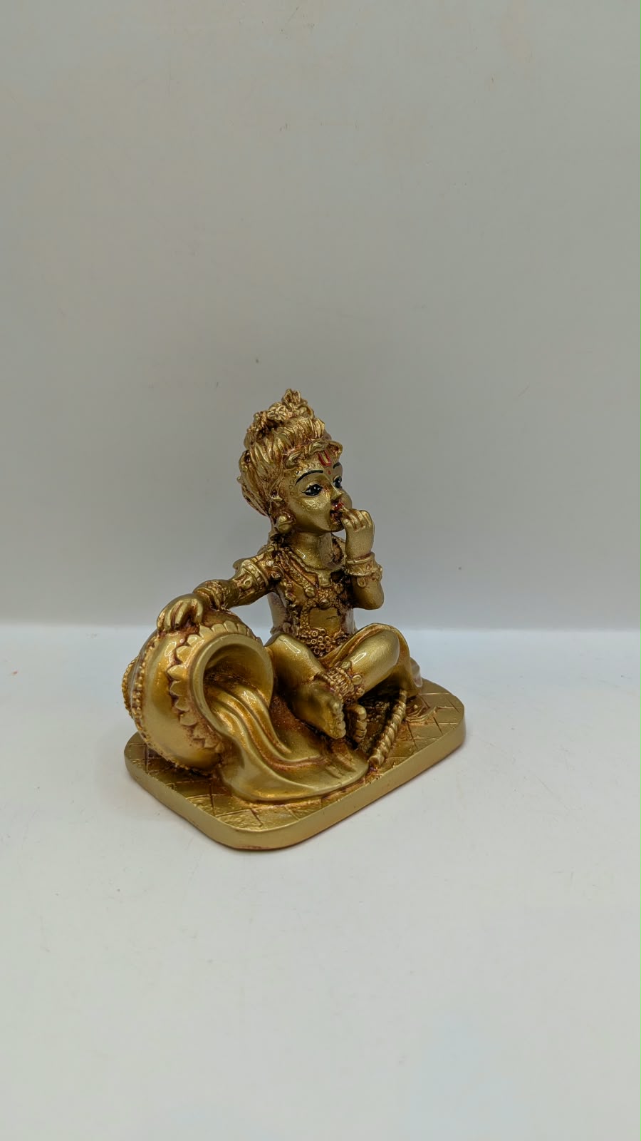 Gold Makhan Chor baby Krishna statue, side view