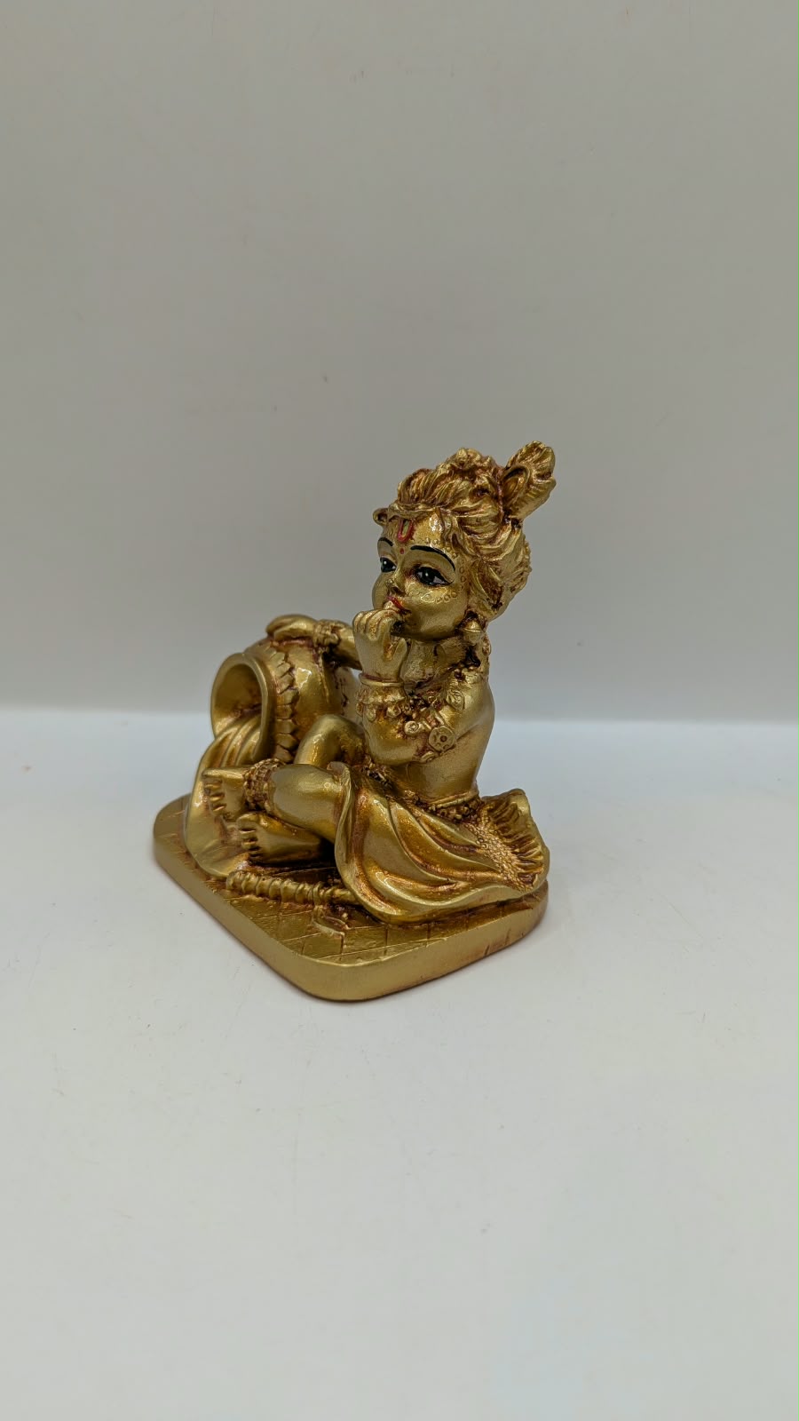 Gold Makhan Chor baby Krishna statue, other side view