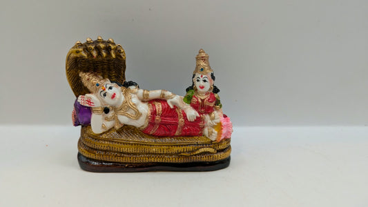 Vishnu Laxmi statue reclining on Sheshnag, front view