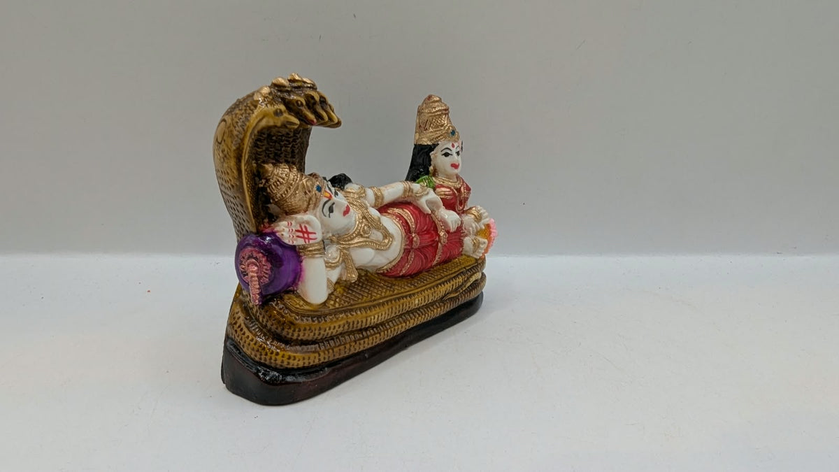 Vishnu Laxmi statue reclining on Sheshnag, side view