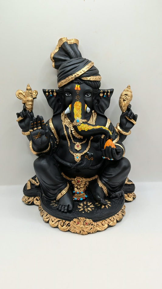 Black and gold Ganesh statue with turban, front view