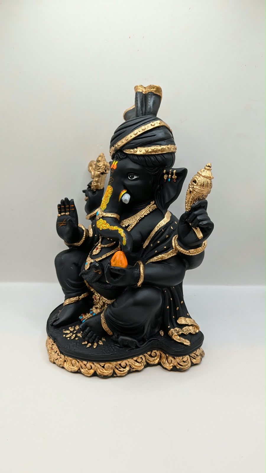 Black and gold Ganesh statue with turban, other side view