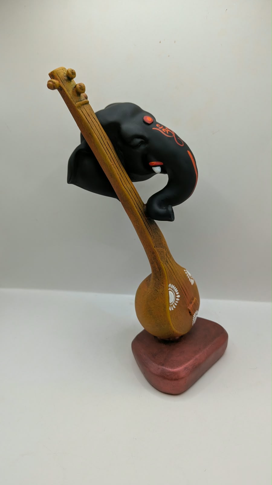 Ganesh head on veena statue, side view