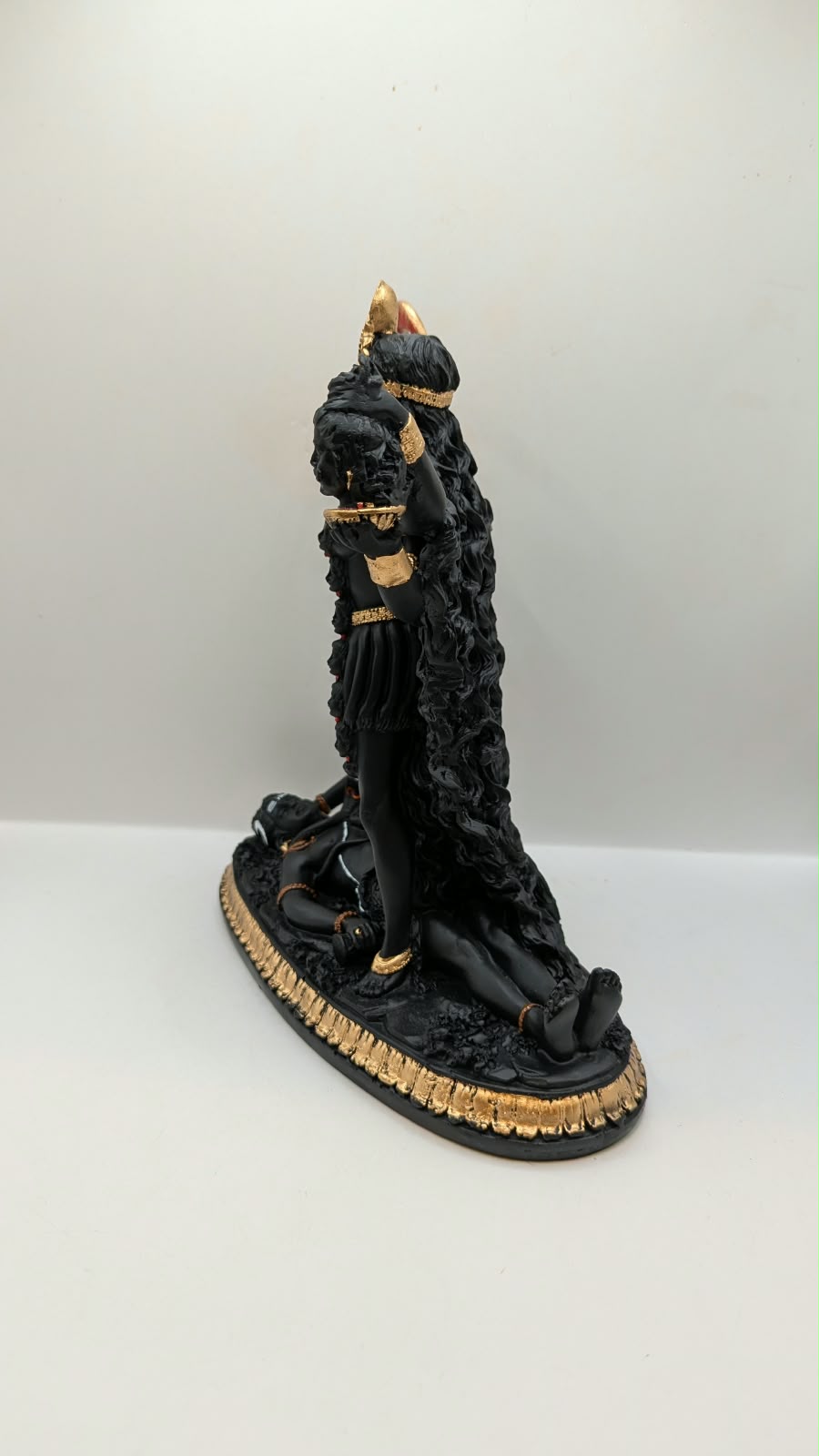 Black and gold Kali Maa statue, other side view