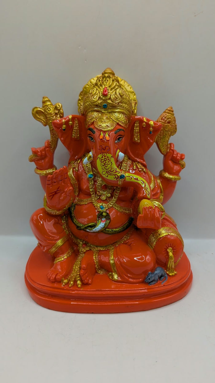 Orange and gold Ganesh statue, front view