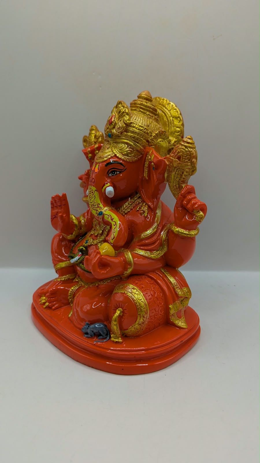 Orange and gold Ganesh statue, other side view