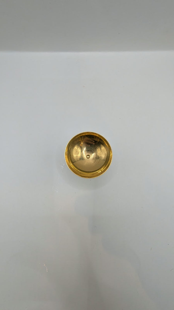 Metal diya on stand, front view