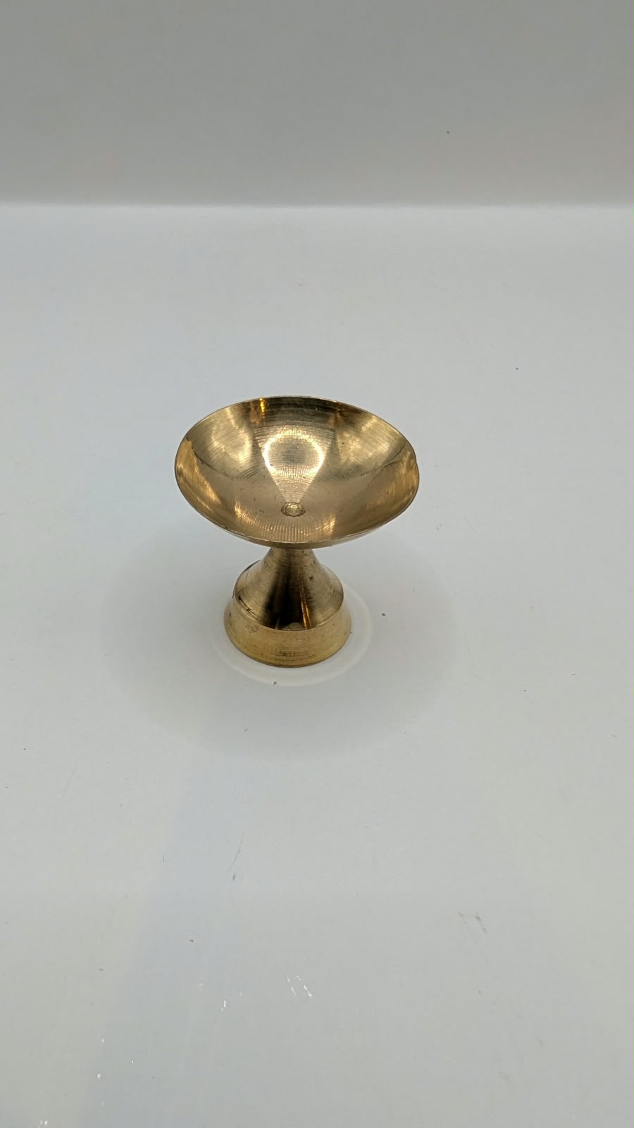 Mini metal diya on stand, front view