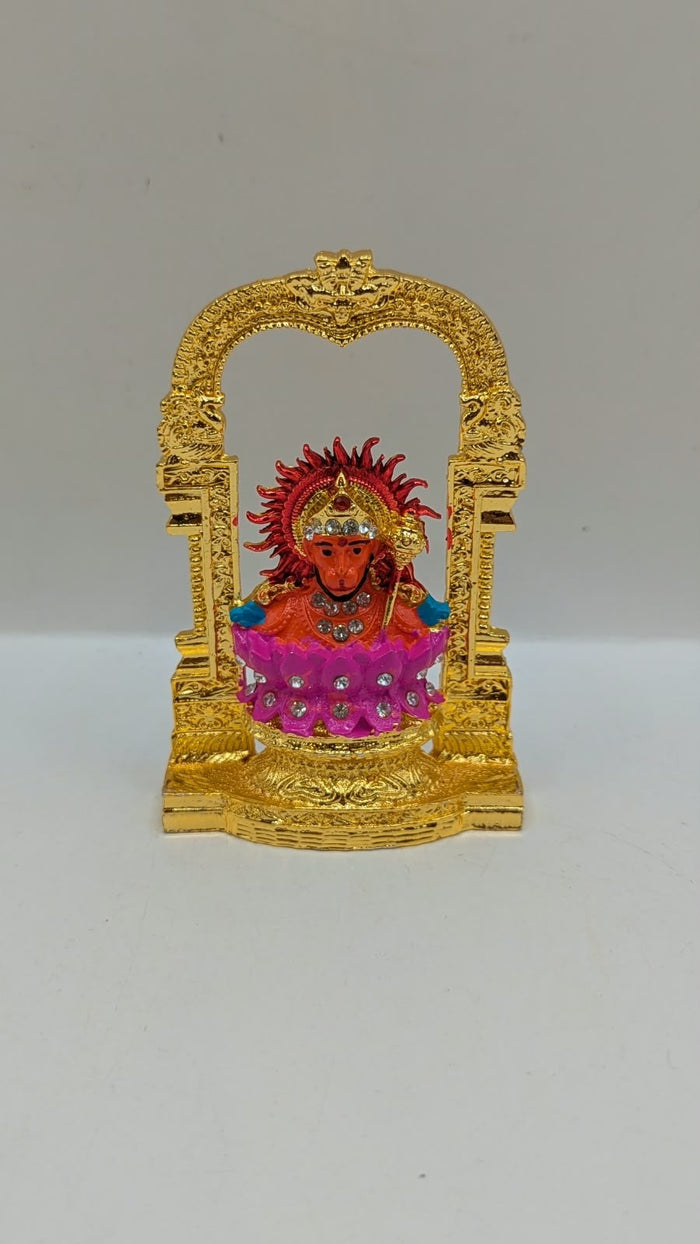 Gold Hanuman murti in temple arch on pink lotus, front view