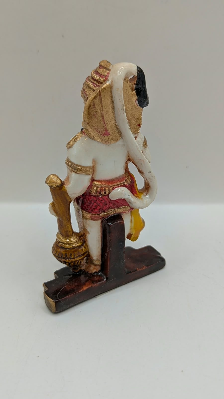 Red and gold standing Hanuman resin statue, back view