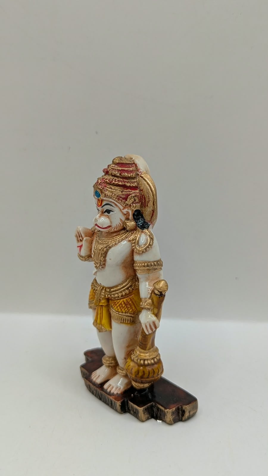 Blue and yellow standing Hanuman resin statue, side view