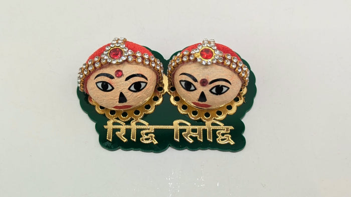 Riddhi Siddhi faces on green base, front view