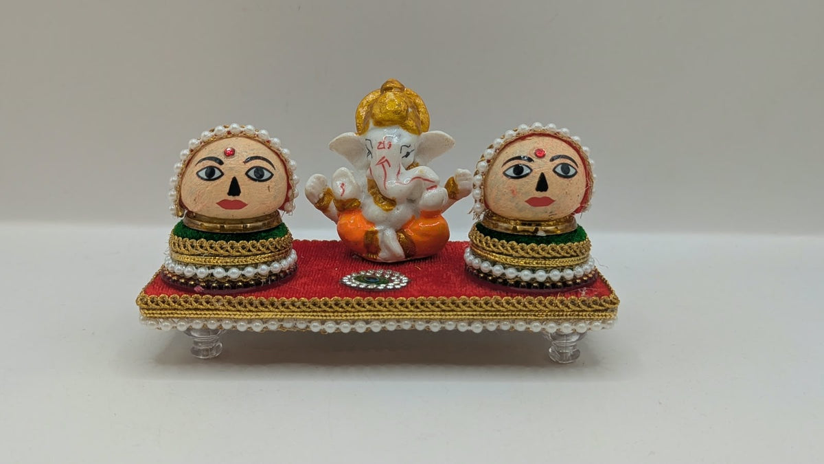 Ganesh Riddhi Siddhi set on red chowki, front view