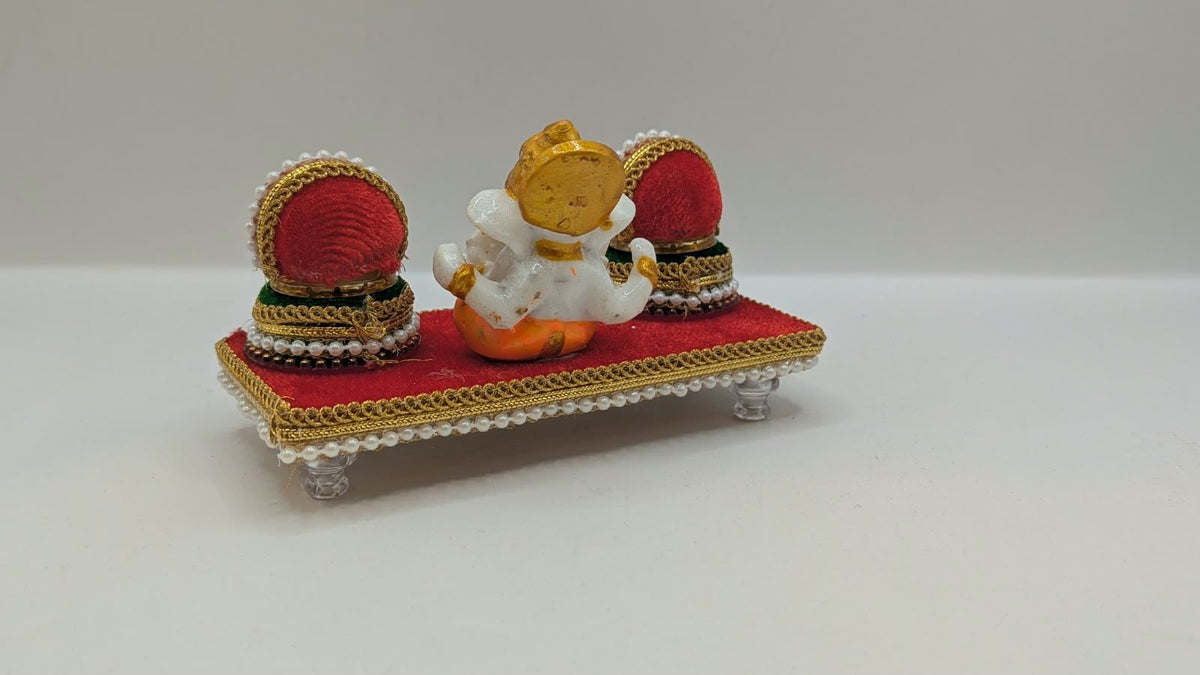 Ganesh Riddhi Siddhi set on red chowki, back view