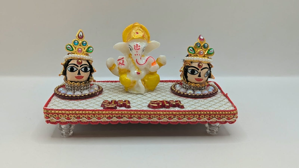 Ganesh Riddhi Siddhi set on white chowki, front view