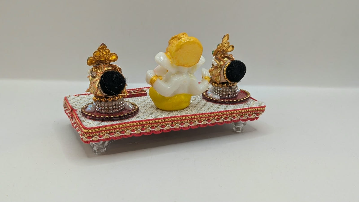 Ganesh Riddhi Siddhi set on white chowki, back view