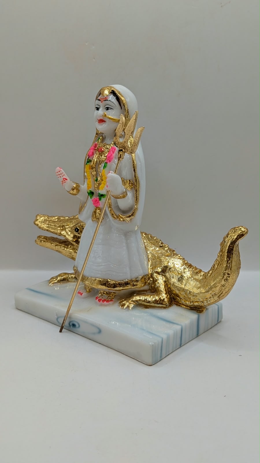 White and gold Khodiyar Maa statue, other side view