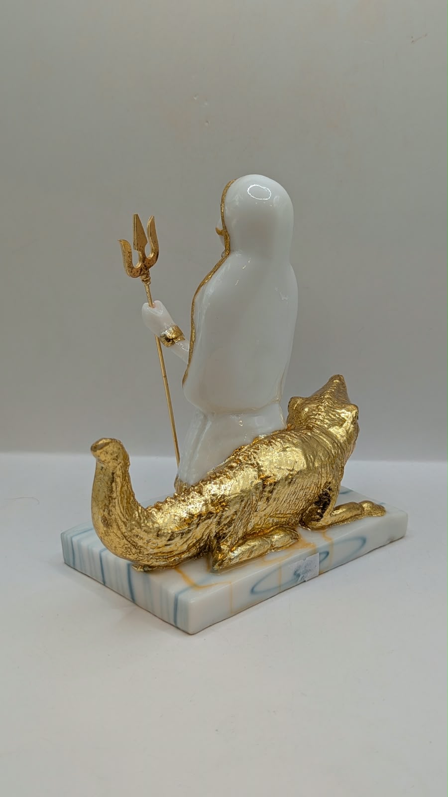 White and gold Khodiyar Maa statue, back view