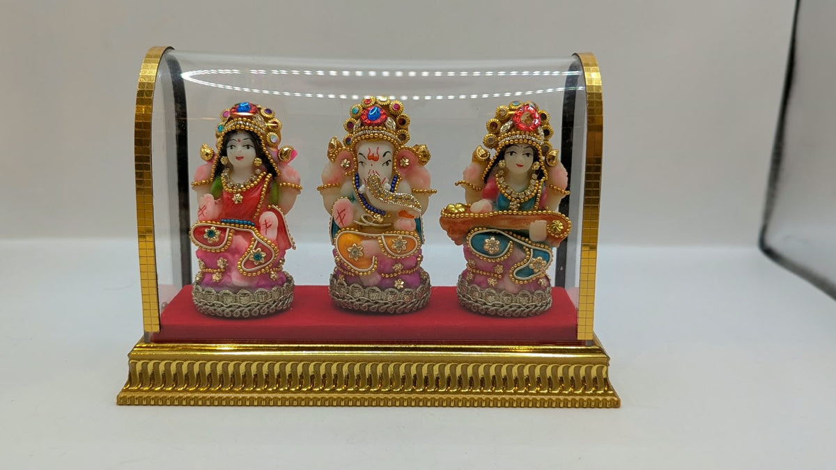 Lakshmi Ganesh Saraswati set in clear case, front view