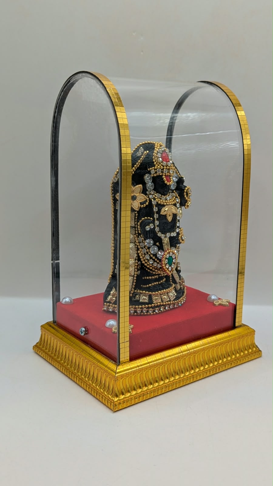 Tirupati Balaji murti in clear case, side view