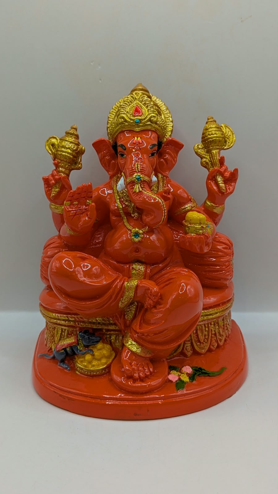 Orange Ganesh statue, front view