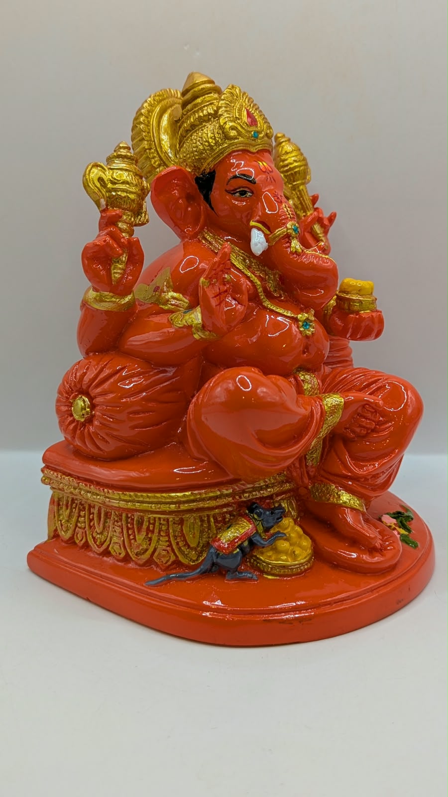 Orange Ganesh statue, side view