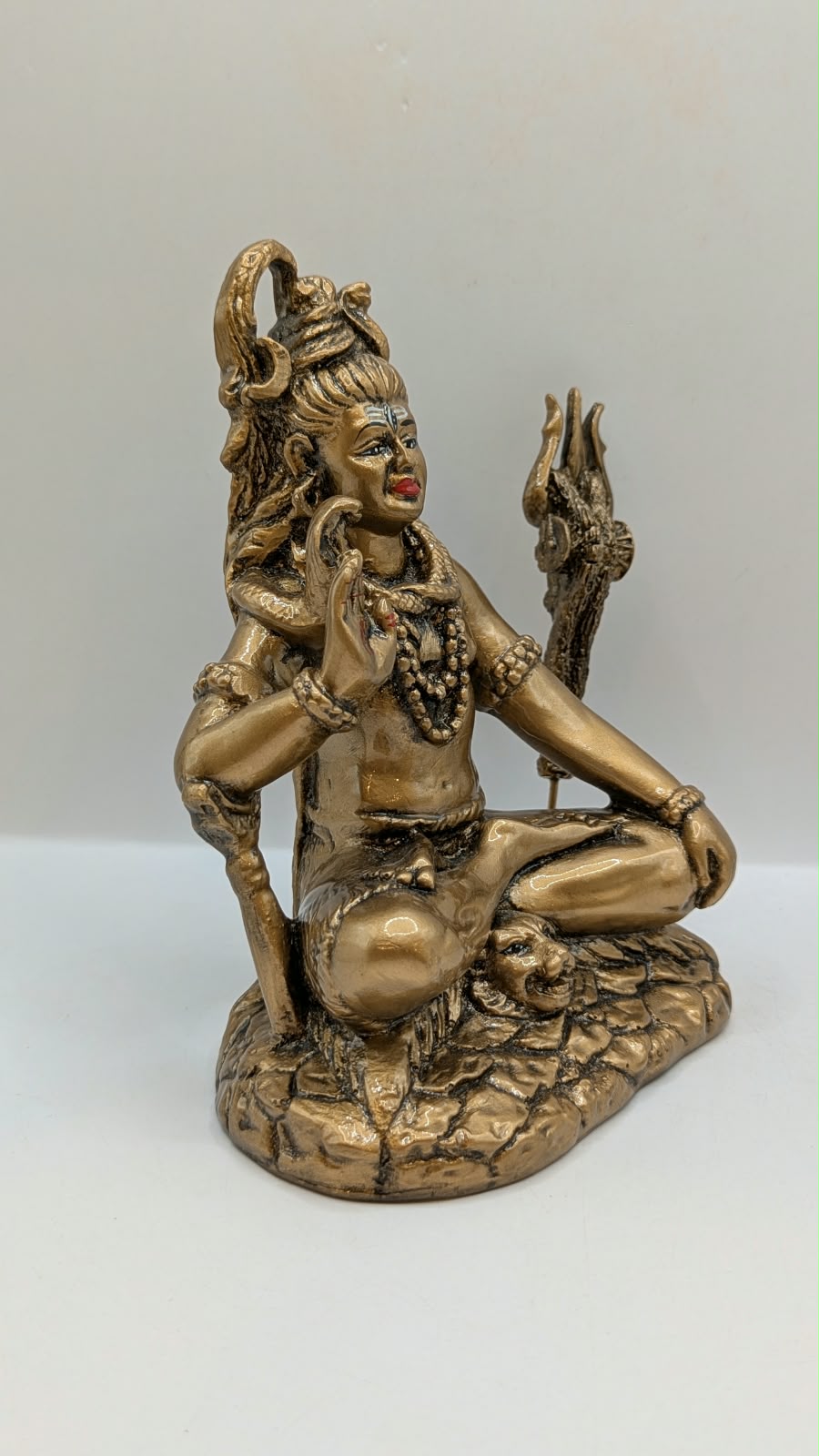Antique gold Shiva statue, side view