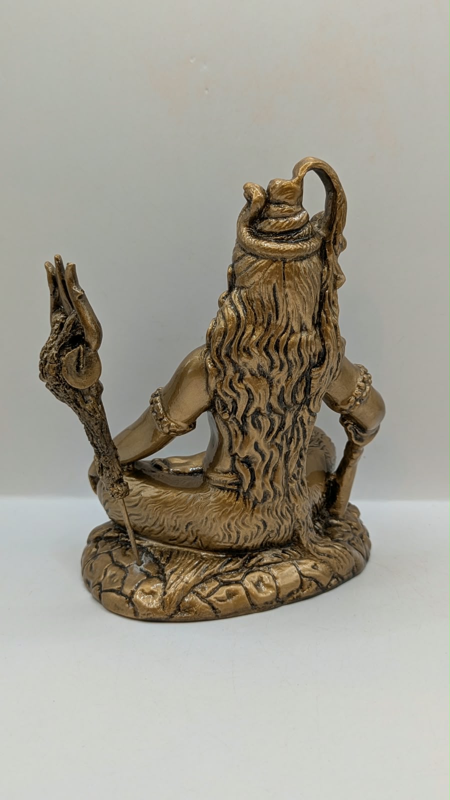 Antique gold Shiva statue, back view