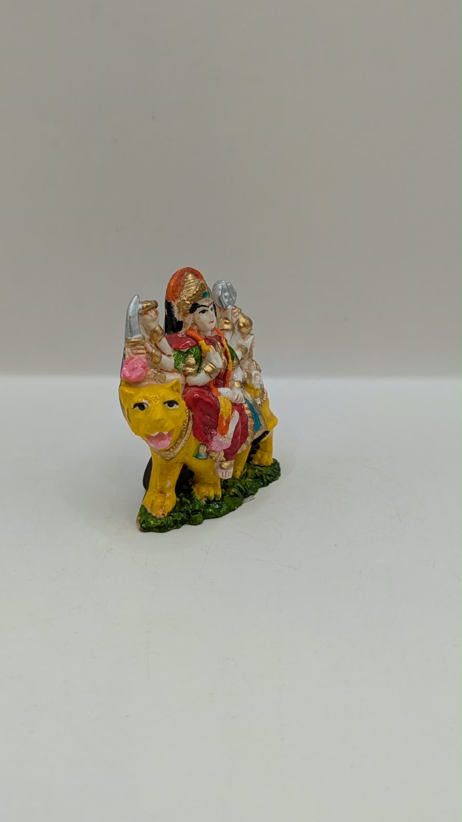 Small Durga Maa on lion statue, side view