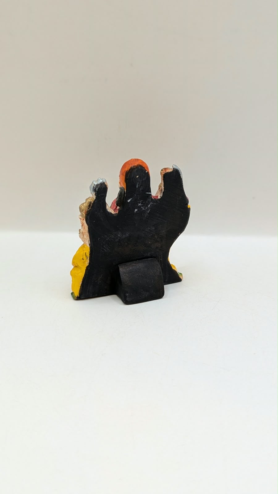 Small Durga Maa on lion statue, back view