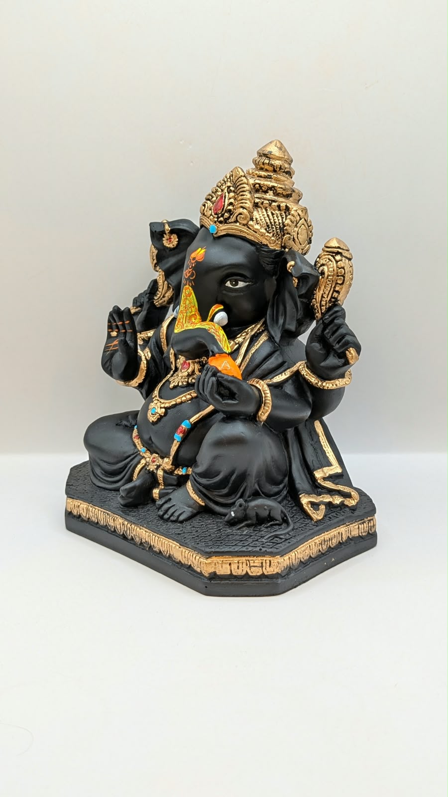 Black and gold Ganesh statue, other side view