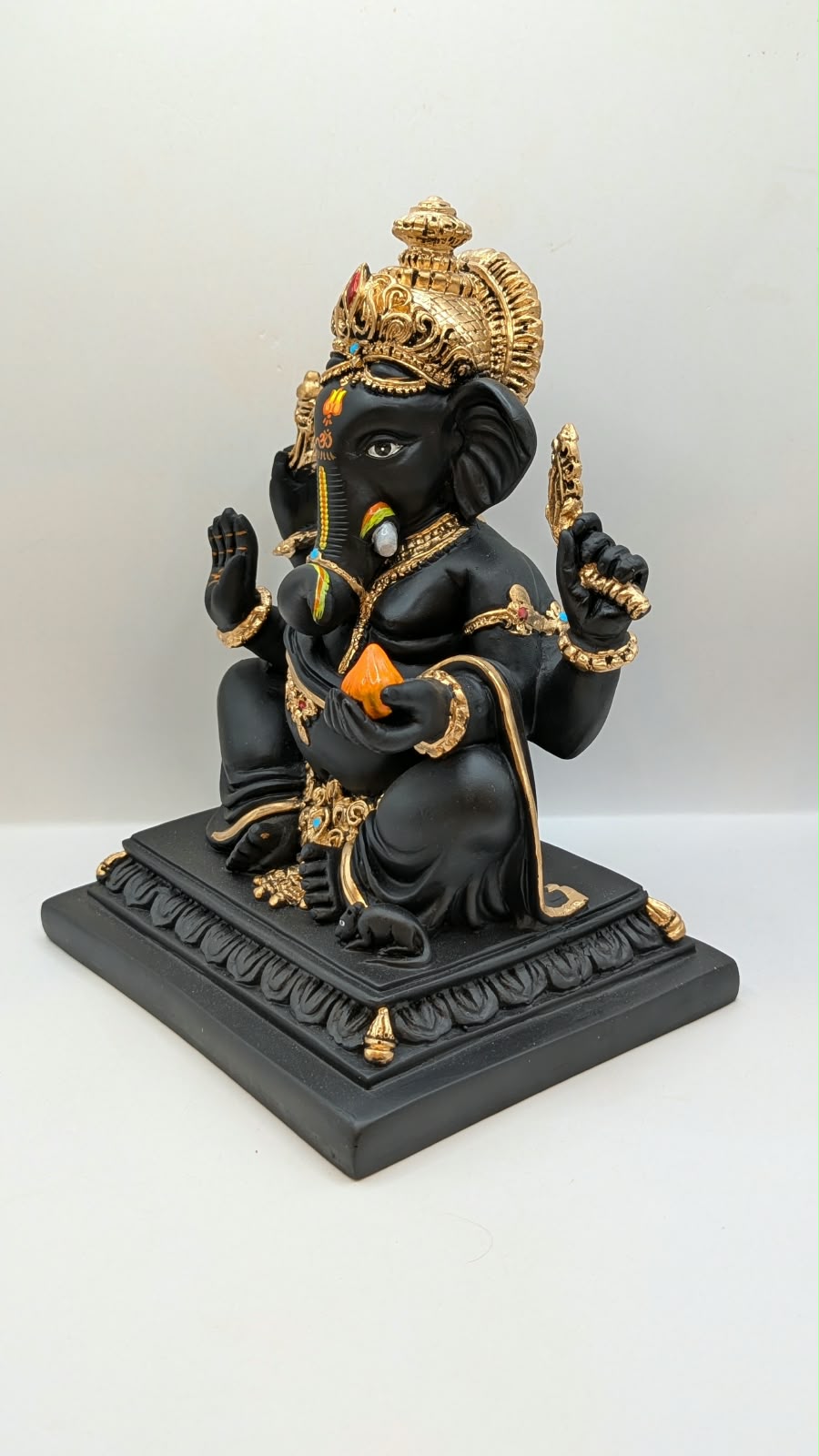 Black Ganesh on square base, other side view