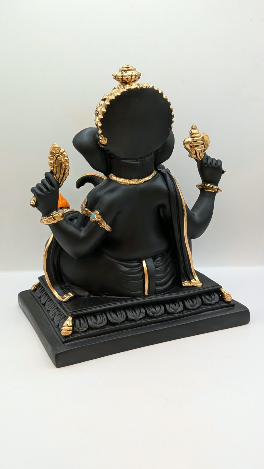 Black Ganesh on square base, back view