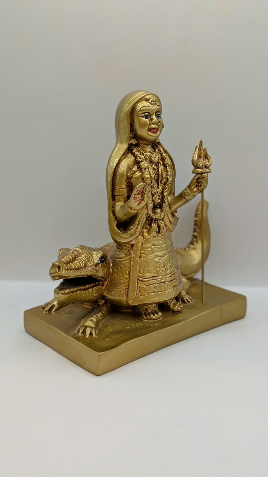 Gold Khodiyar Maa statue, side view