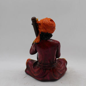 Rajasthani boy,Rajasthani man,Musician man Rajasthani statue, idol Maroon color