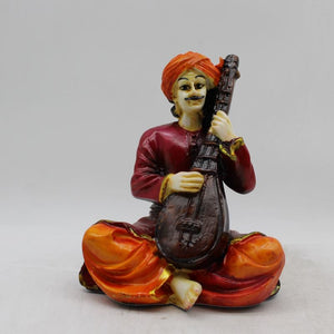 Rajasthani boy,Rajasthani man,Musician man Rajasthani statue, idol Maroon color