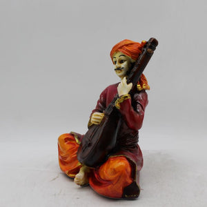 Rajasthani boy,Rajasthani man,Musician man Rajasthani statue, idol Maroon color