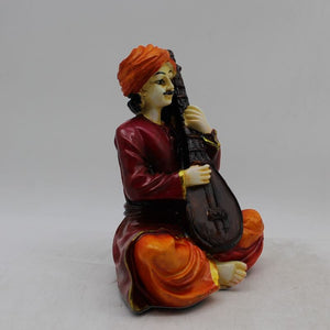 Rajasthani boy,Rajasthani man,Musician man Rajasthani statue, idol Maroon color