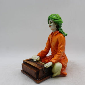 Rajasthani boy,Rajasthani man,Musician man Rajasthani statue, idol Orange color